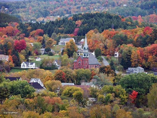 the town of lyndonville vermont with fall foliage
