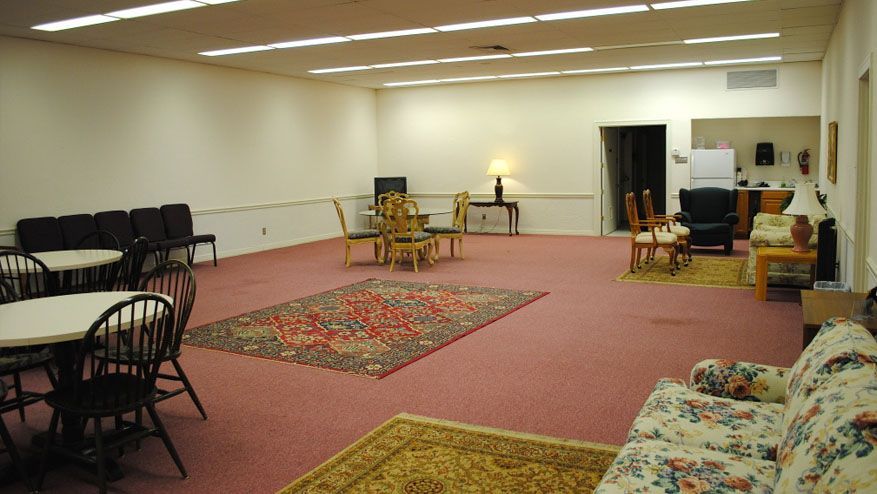 a large room with tables and chairs in it