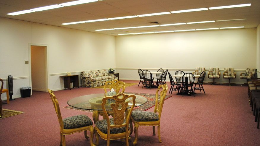 a large room with tables and chairs in it