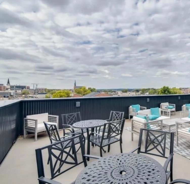 Rooftop patio with plenty of chairs and patio seating