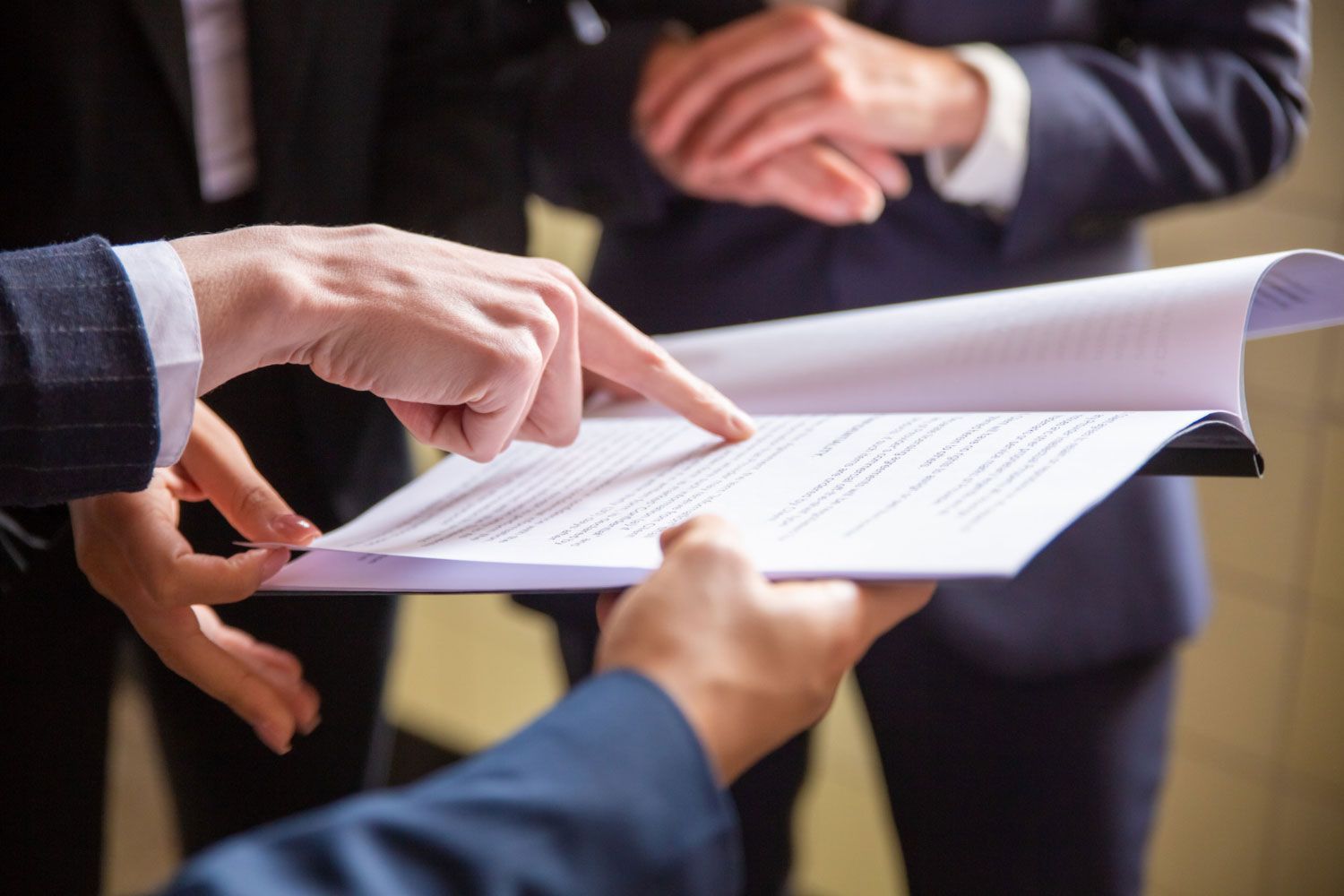 A group of people are looking at a piece of paper.
