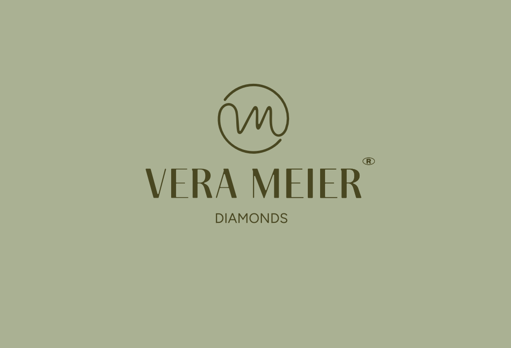 Logotipo de VLA MILLR sobre un fondo verde apagado con un monograma circular encima del texto.