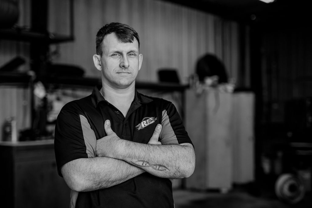 Man with arms crossed | Redline Automotive