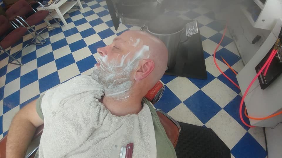 A Man Is Wearing A Gold Mask On His Face