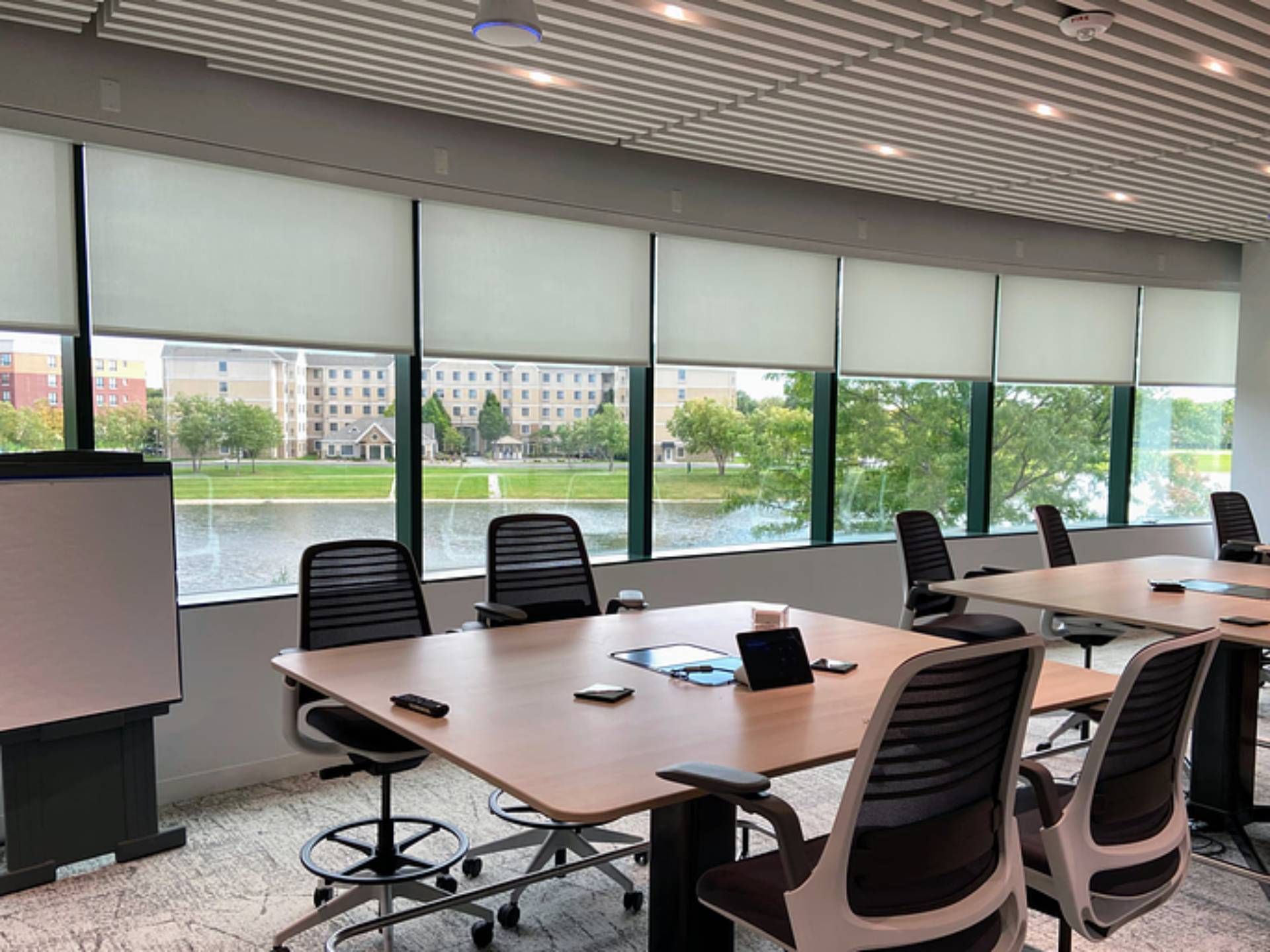 Commercial office with Hunter Douglas commercial roller shades near Bloomington, IL