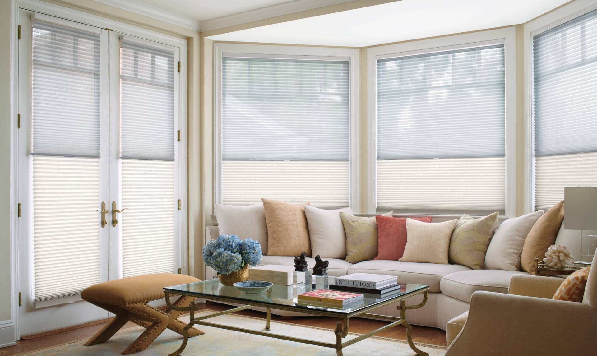 Hunter Douglas Duette® Cellular Shades covering multiple windows and French door in a living room.