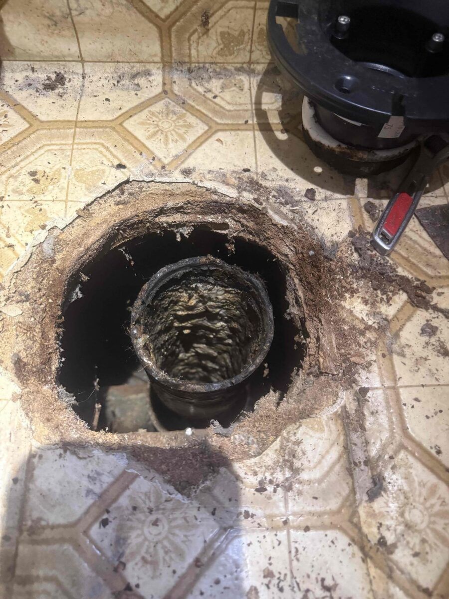Cast iron drain pipe interior corroded and eaten through by chemical drain cleaner in a Utah home.