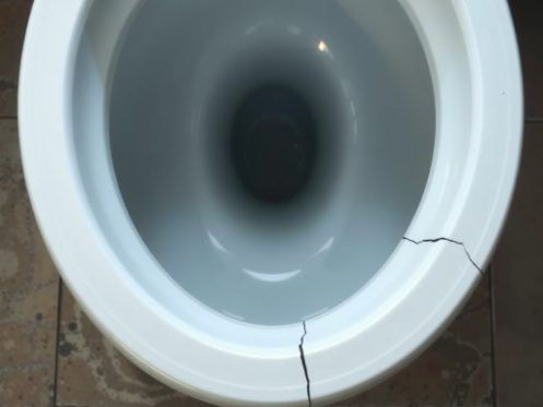 toilet base crack porcelain damage visible inspection