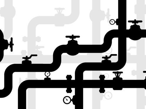 Black and gray pipes with valves and gauges against a white background.