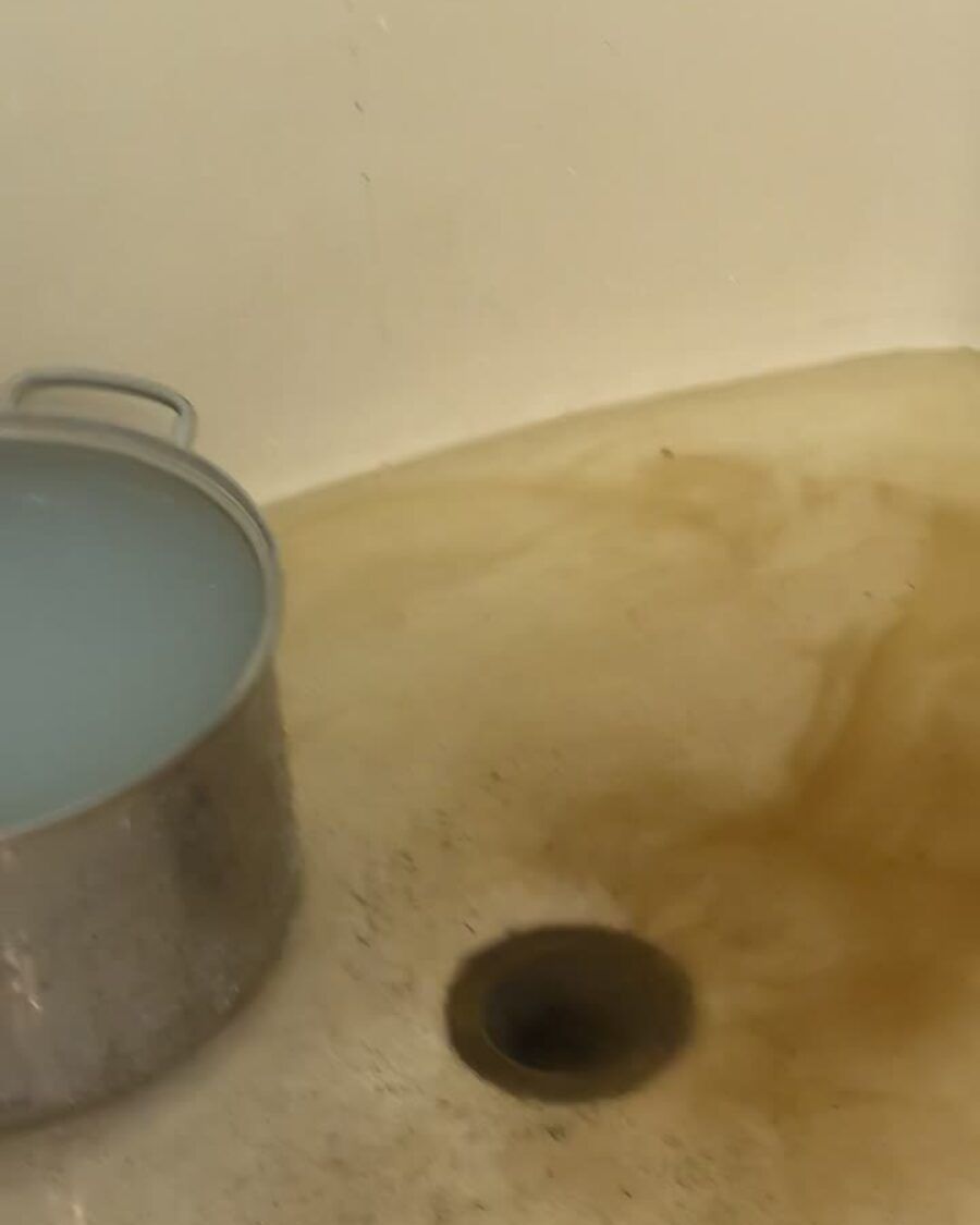 Sewage backing up through a downstairs shower drain in a Utah home