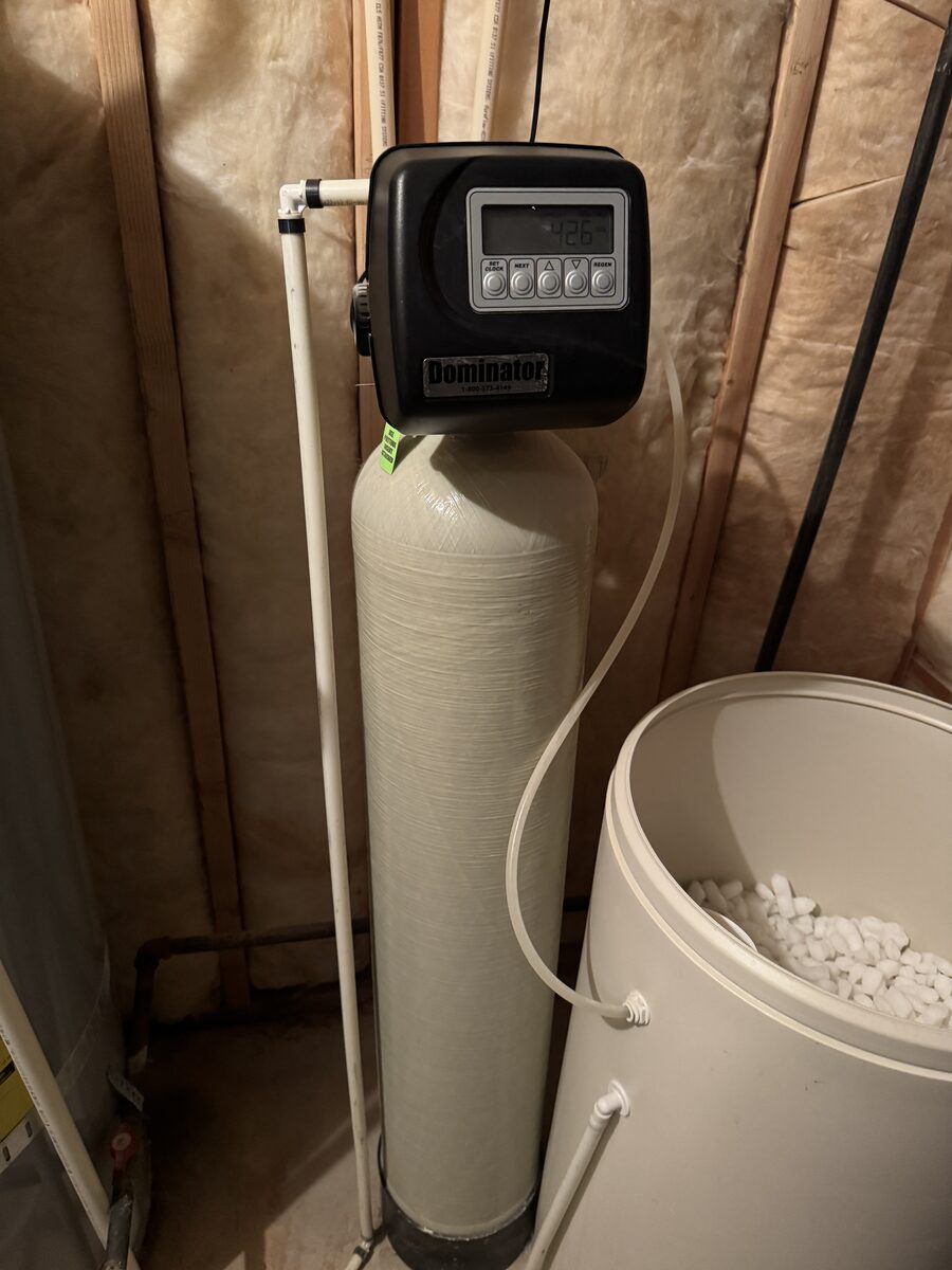 Whole-home water softener with a salt brine tank installed in a Utah home