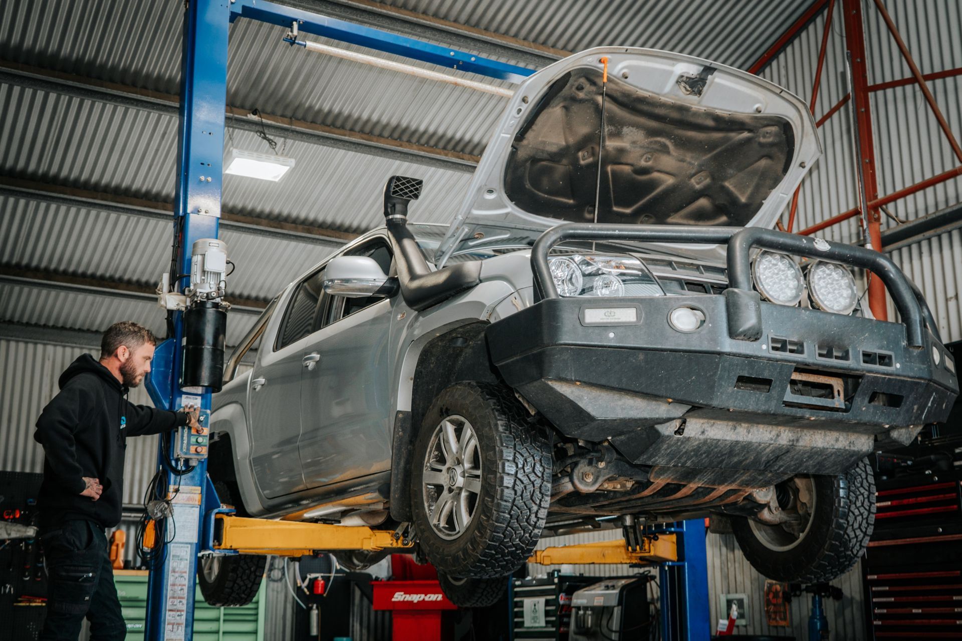 A mechanic inspecting a car in Dubbo