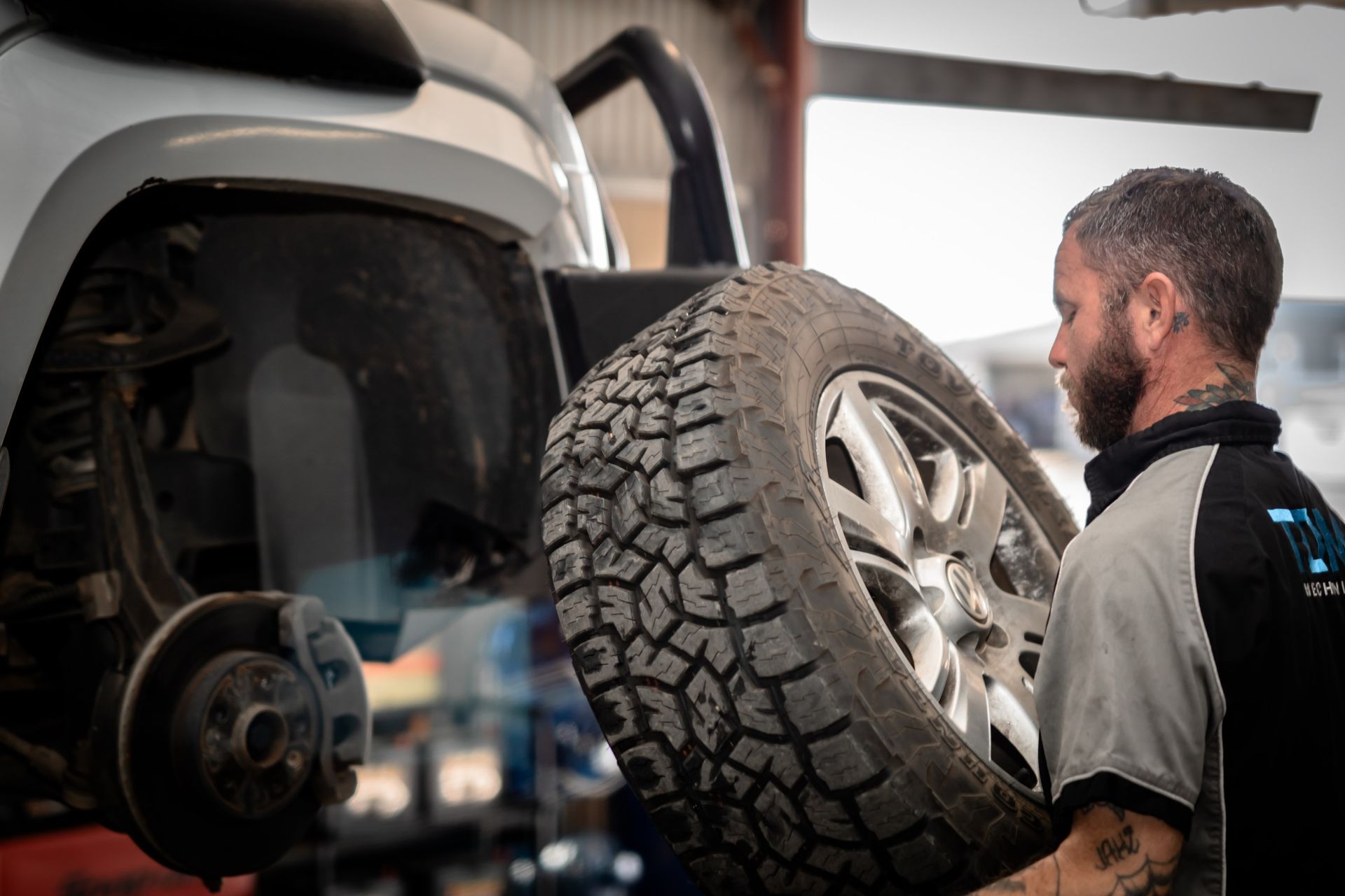 a mechanic aligning a wheel