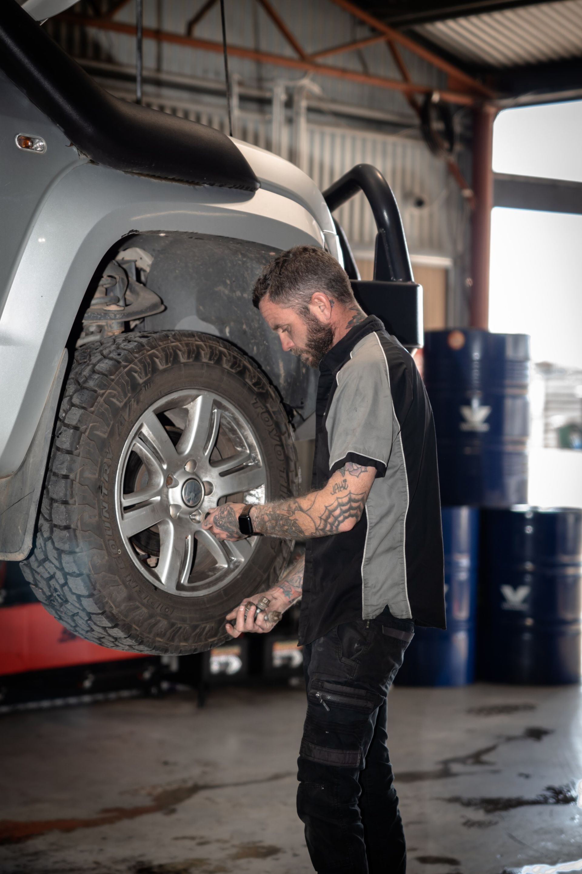 A mechanic changing a wheel