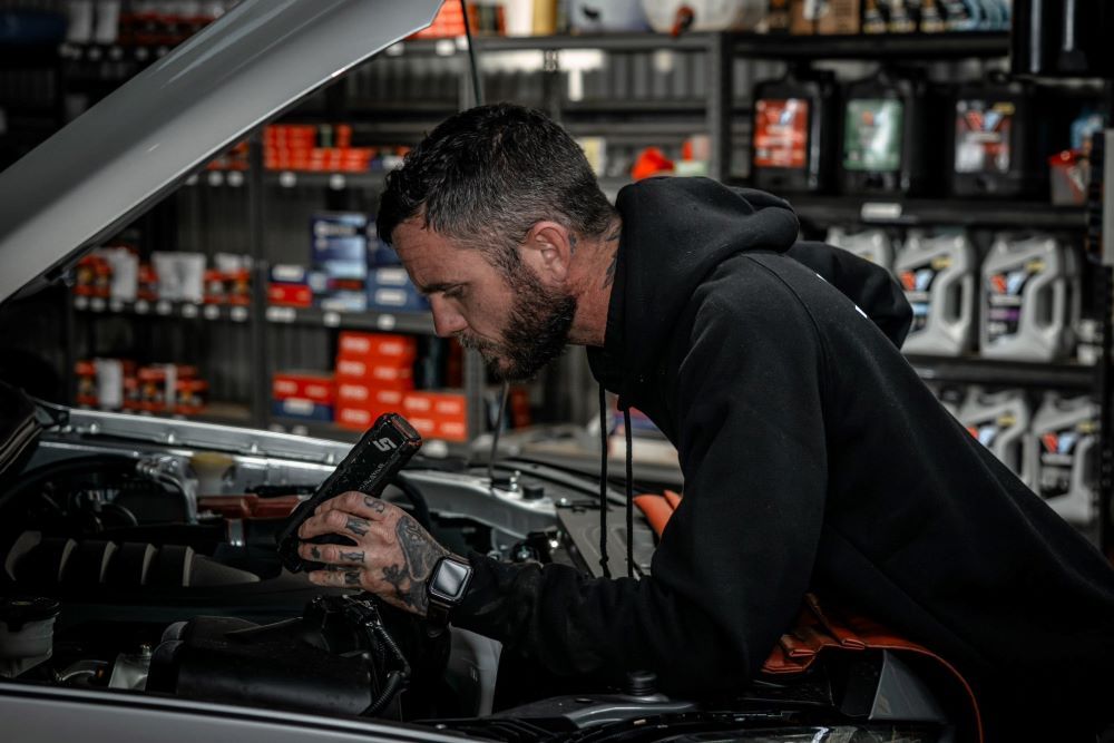 Mechanic inspecting a car