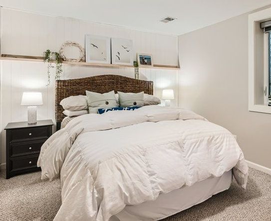 After Image of Guest Bedroom in Basement. Repainted with Classic Gray color and added faux shiplap wall and custom floating shelf. Coastal Cottage Style.