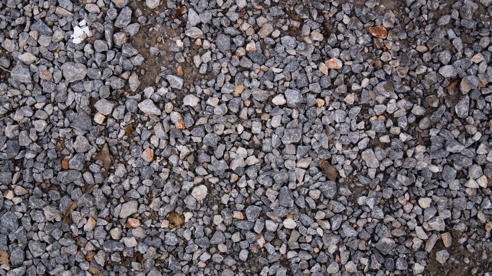 A pile of gravel is sitting on the ground.
