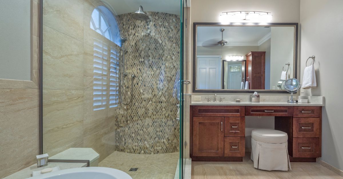 A bathroom with a tub , sink , mirror and walk in shower.