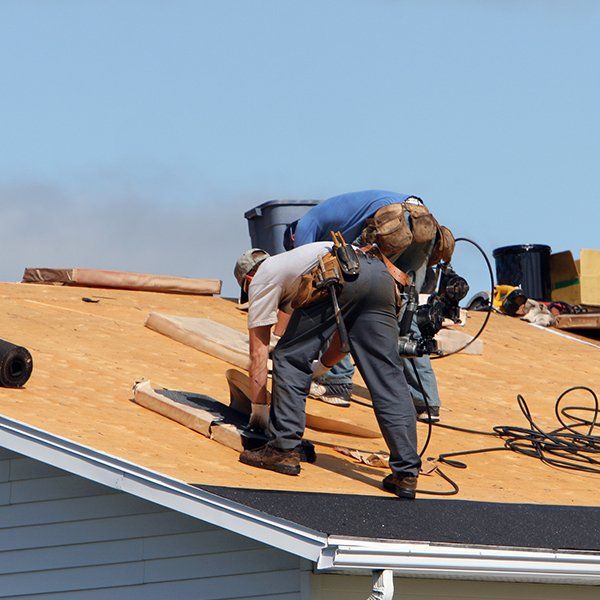 Worker Installing New Roof — Clifton, NJ — Better Built Construction