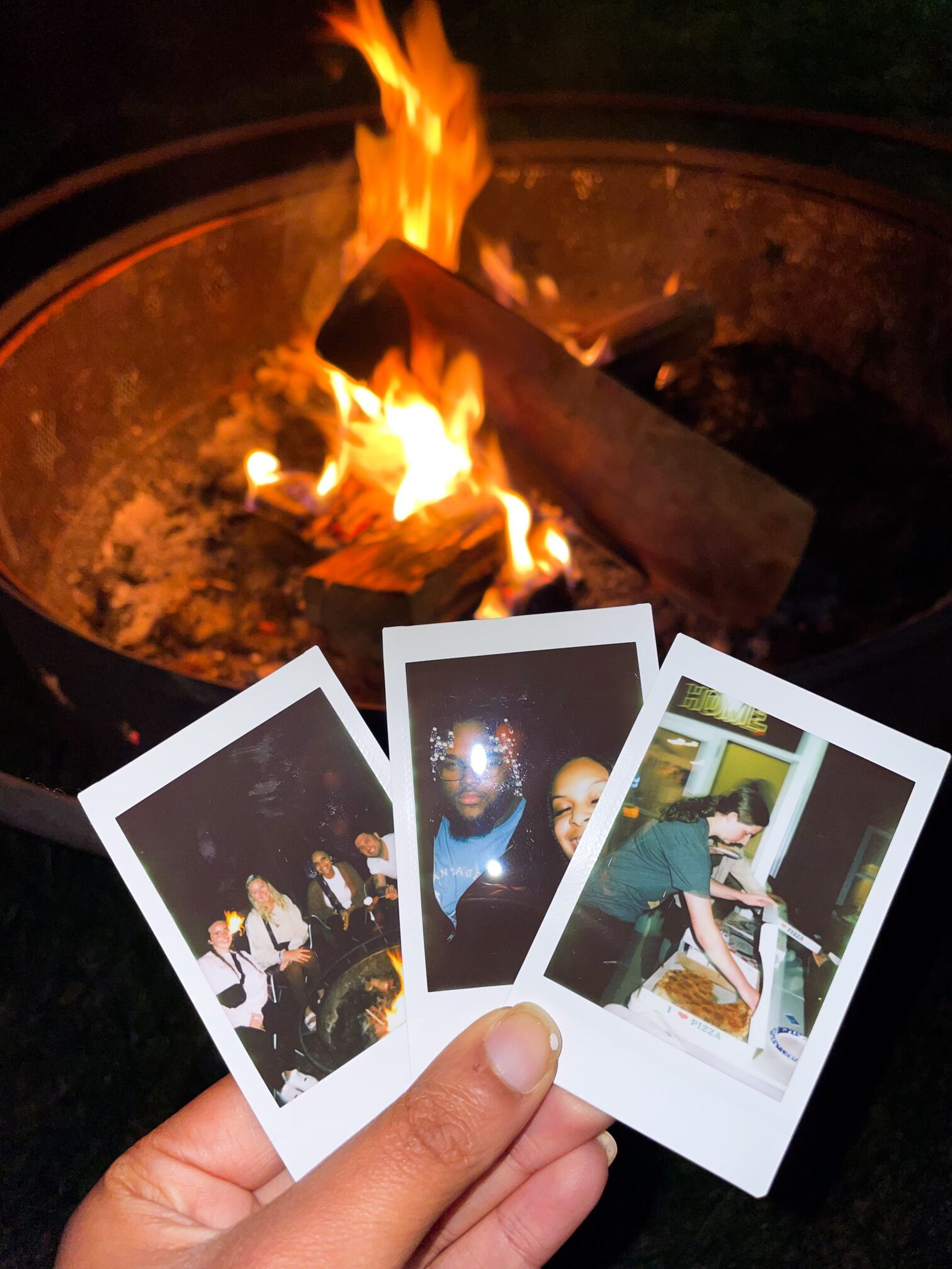 polaroid pictures by the fire
