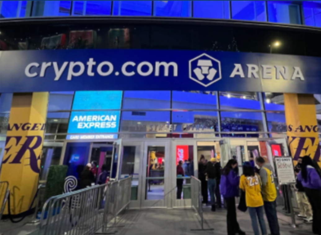 a group of people standing outside of the crypto.com arena