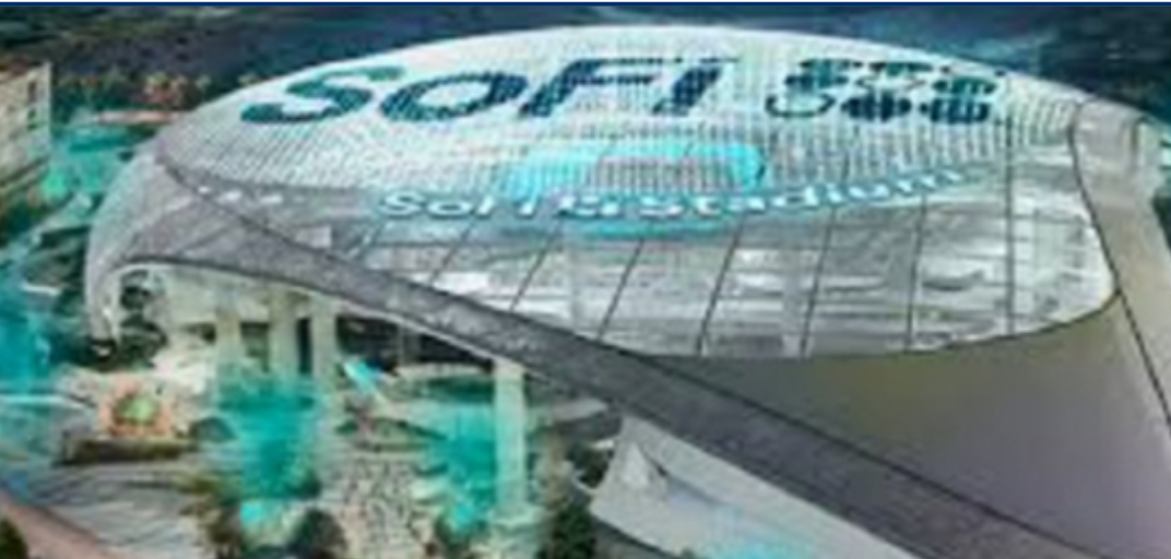 SoFi Stadium illuminated at night. The stadium has a clear roof with the