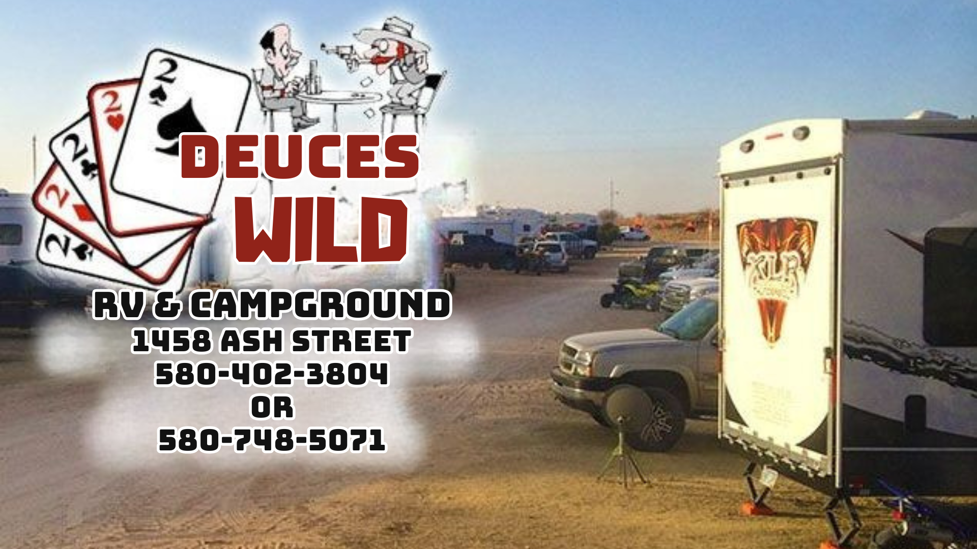 A rv and a truck are parked in front of a sign for deuce 's wild rv & campground