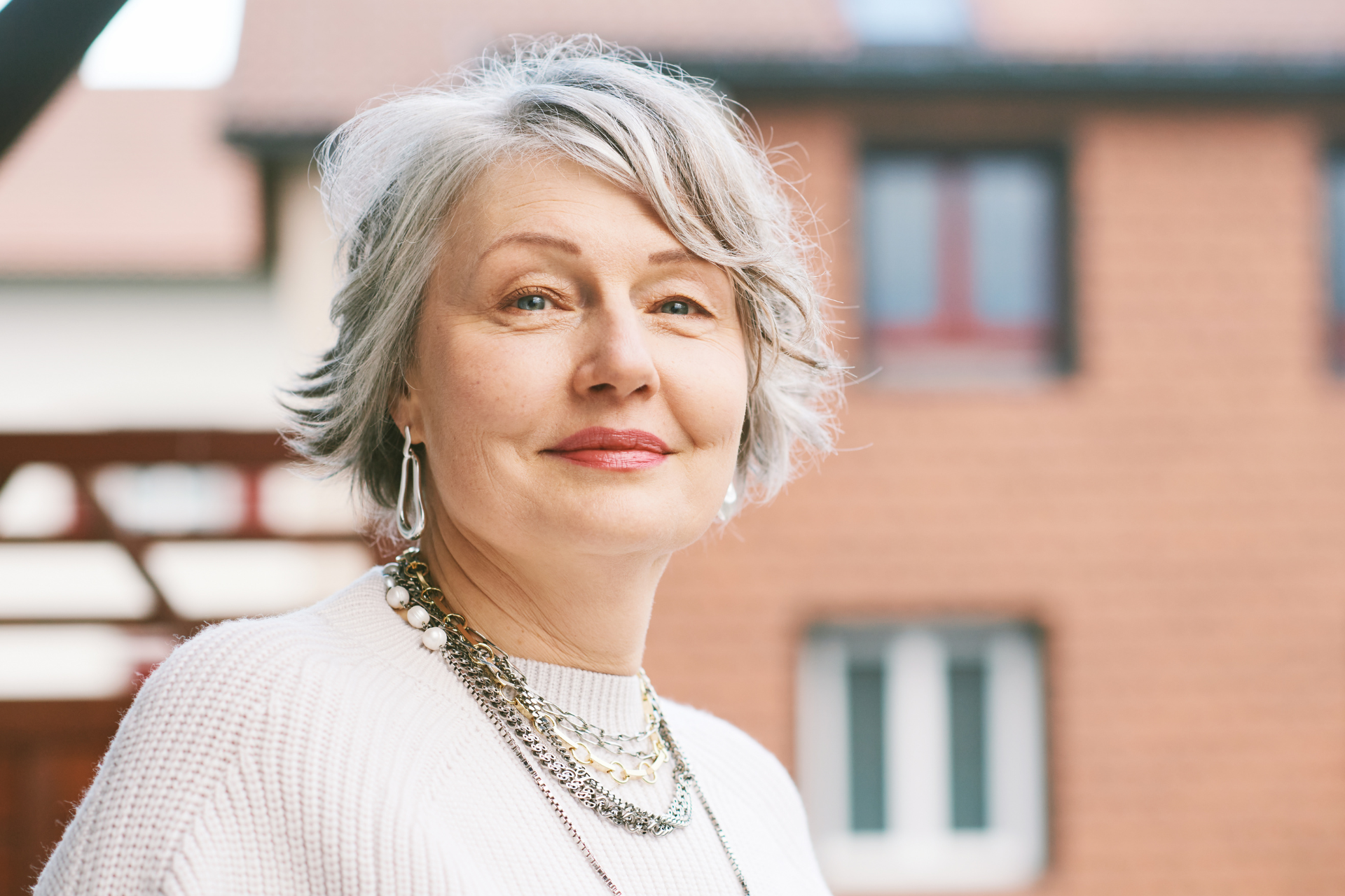 Couple on a couch talking to a therapist in an office setting.