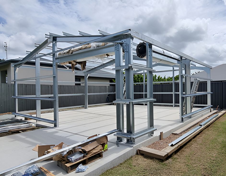 A Metal Structure Is Being Built In The Backyard Of A House — Harris Design & Building Concepts In Jubilee Pocket, QLD