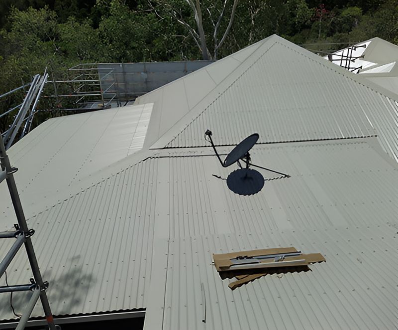 A Satellite Dish Is Sitting On The Roof Of A Building — Harris Design & Building Concepts In Jubilee Pocket, QLD