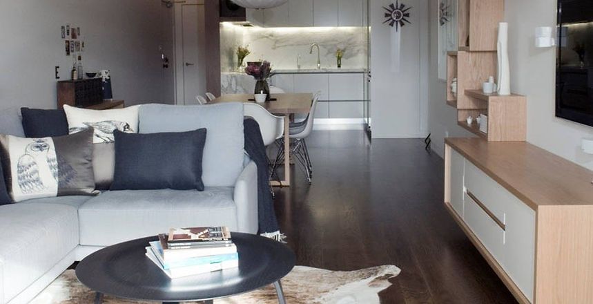 A Living Room With A Couch And A Coffee Table — Harris Design & Building Concepts In Jubilee Pocket, QLD