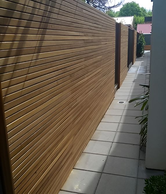 A Wooden Fence Along The Side Of A Walkway — Harris Design & Building Concepts In Jubilee Pocket, QLD