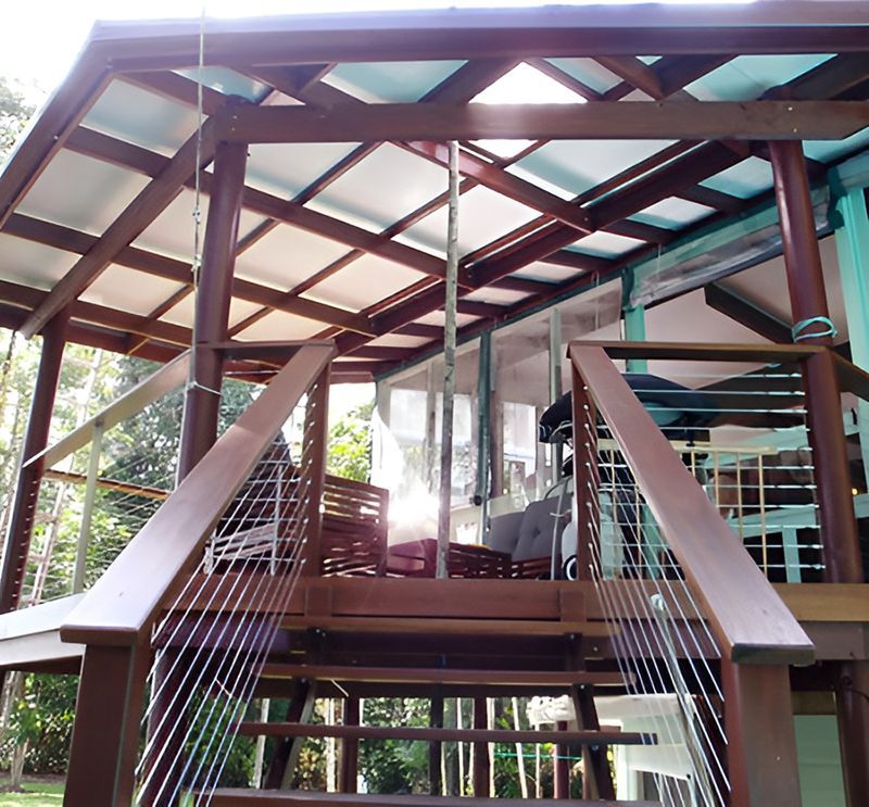 A Wooden Deck With Stairs Leading Up To It — Harris Design & Building Concepts In Jubilee Pocket, QLD