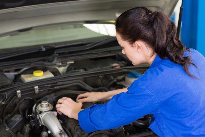 woman checking the car engine