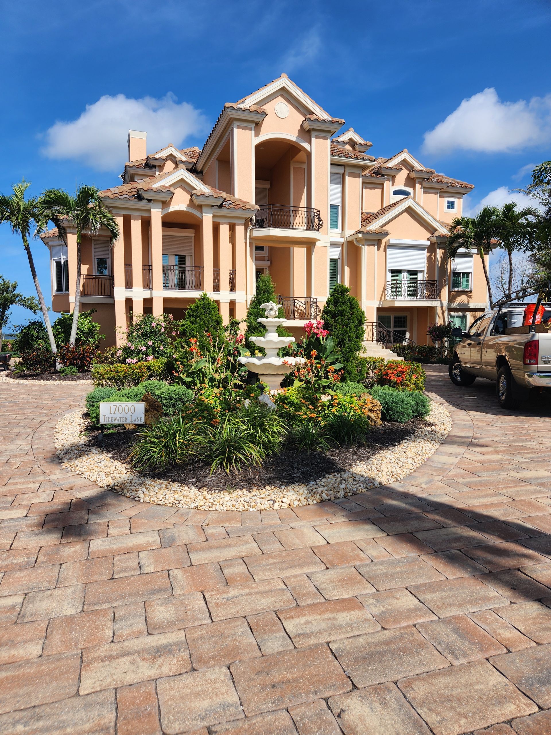 A large house with cars parked in front of it