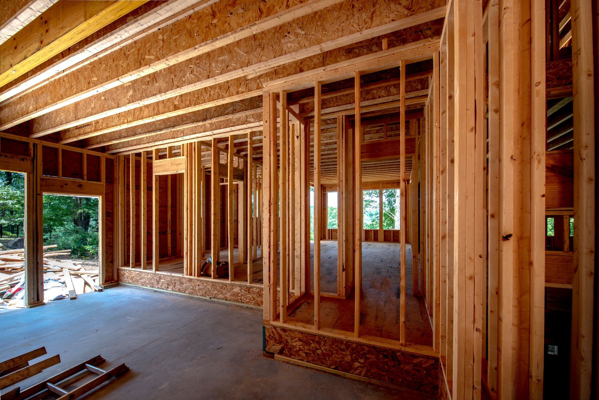 A stone fireplace in a building under construction