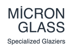 A logo for a company called micron glass specialized glaziers.