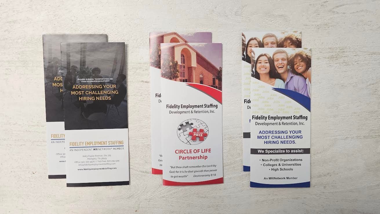 Three stacks of brochures with different designs.