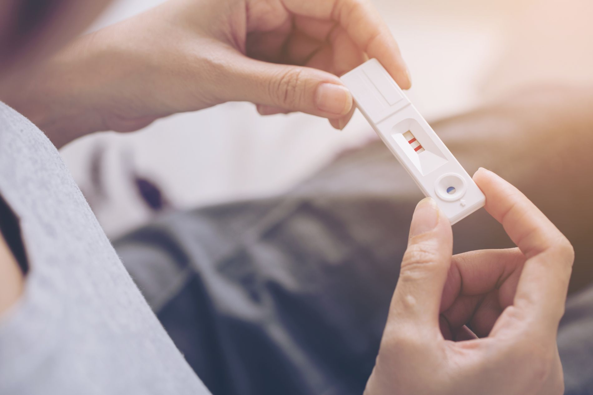 Person holding pregnancy test