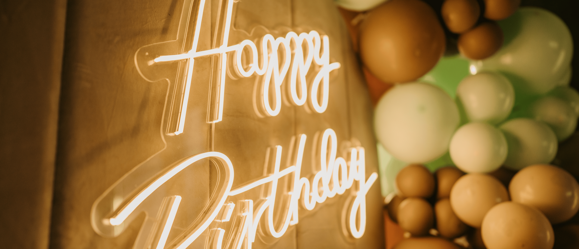 A birthday party with a led sign 'Happy Birthday'