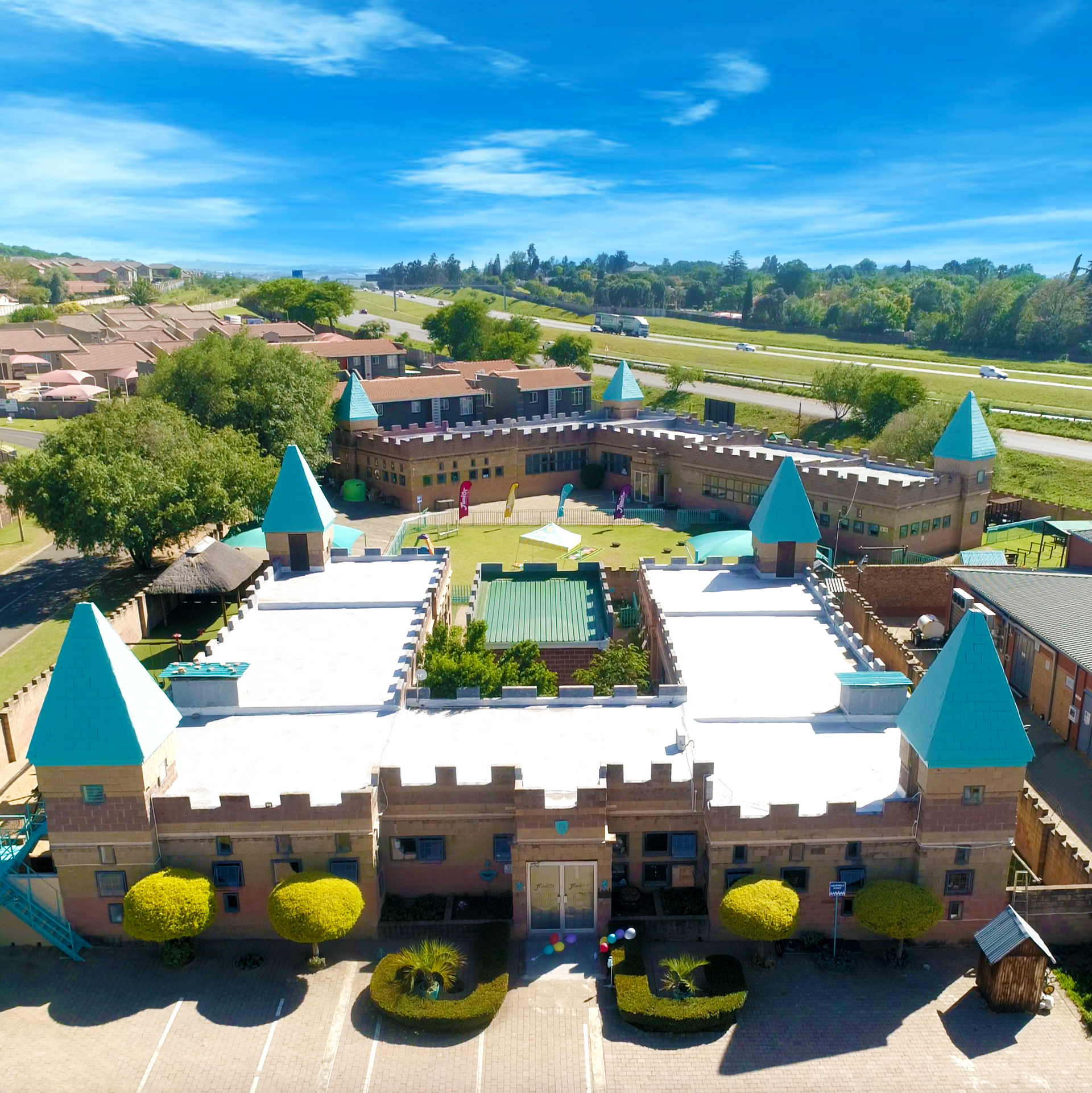 An aerial view of a large castle shaped building