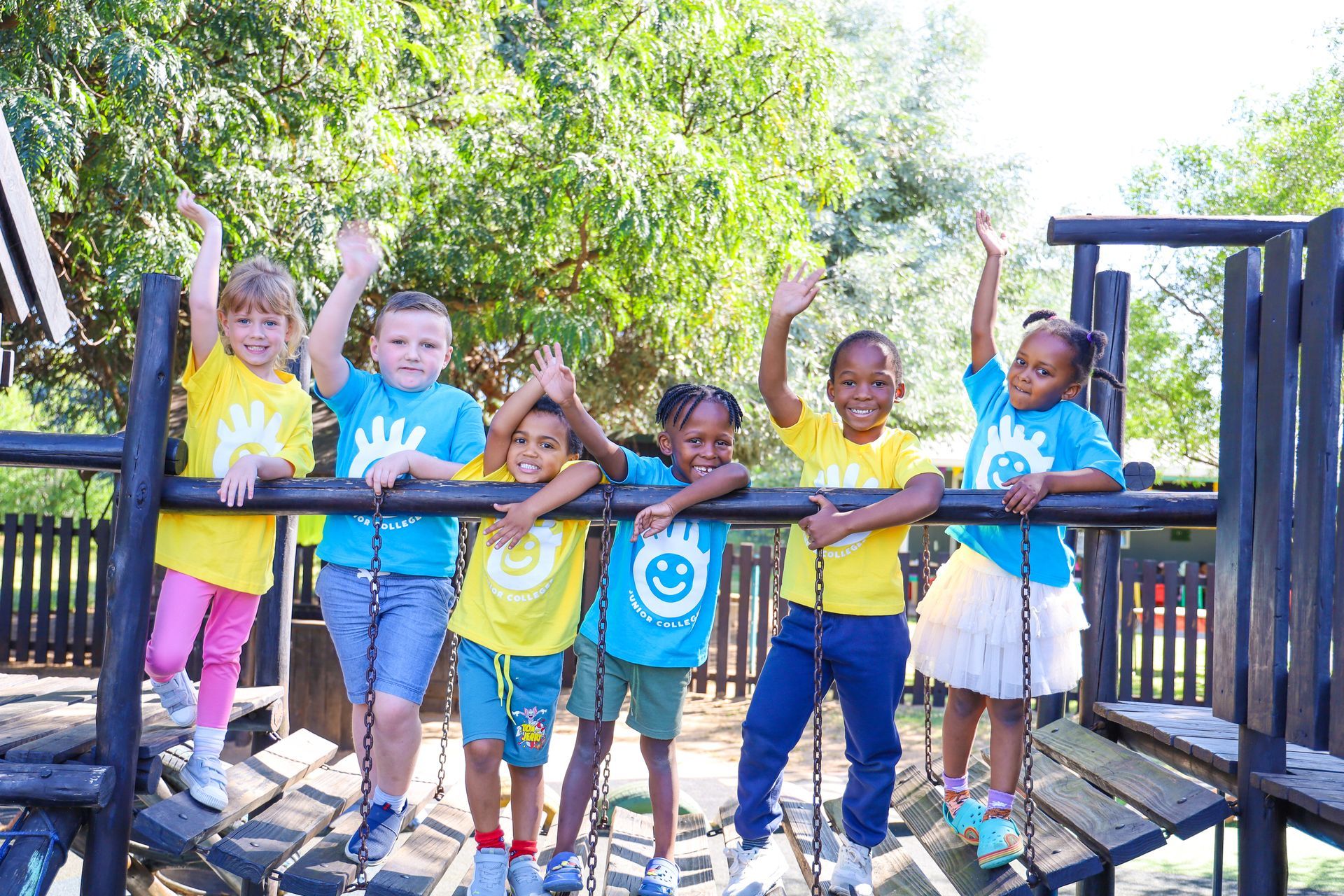 Two young boys are playing in a foamy sandbox.