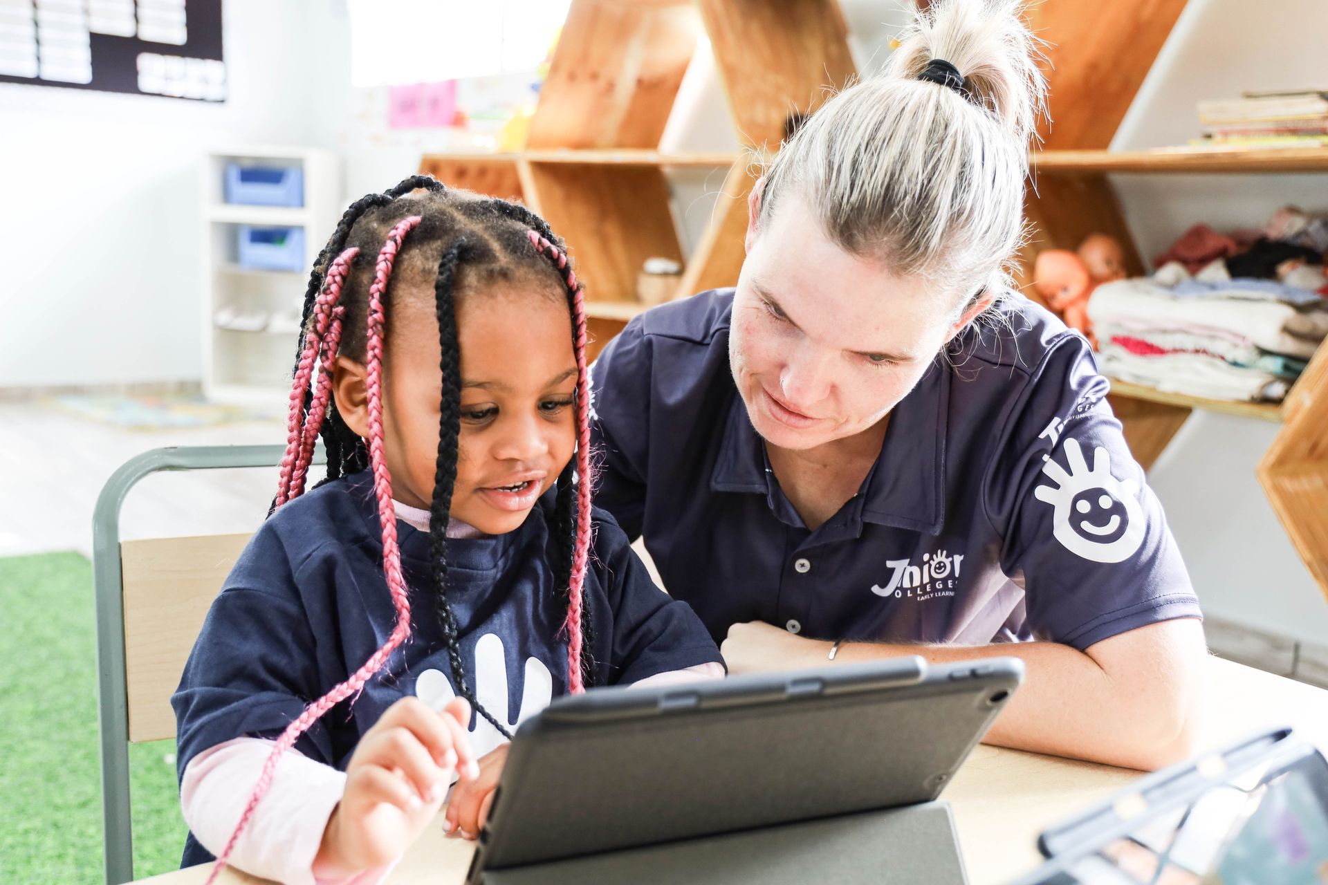 A group of children are playing on swings in a park