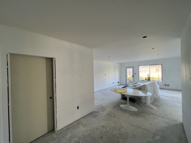 There is a table in the middle of the room.
