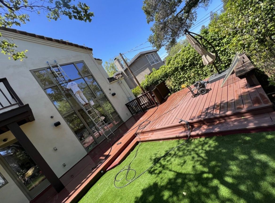A house with a large deck and a large window