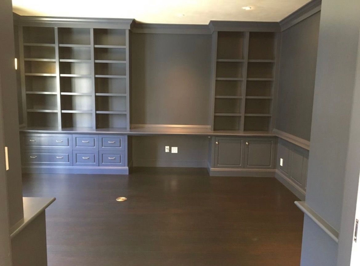 An empty room with lots of shelves and drawers