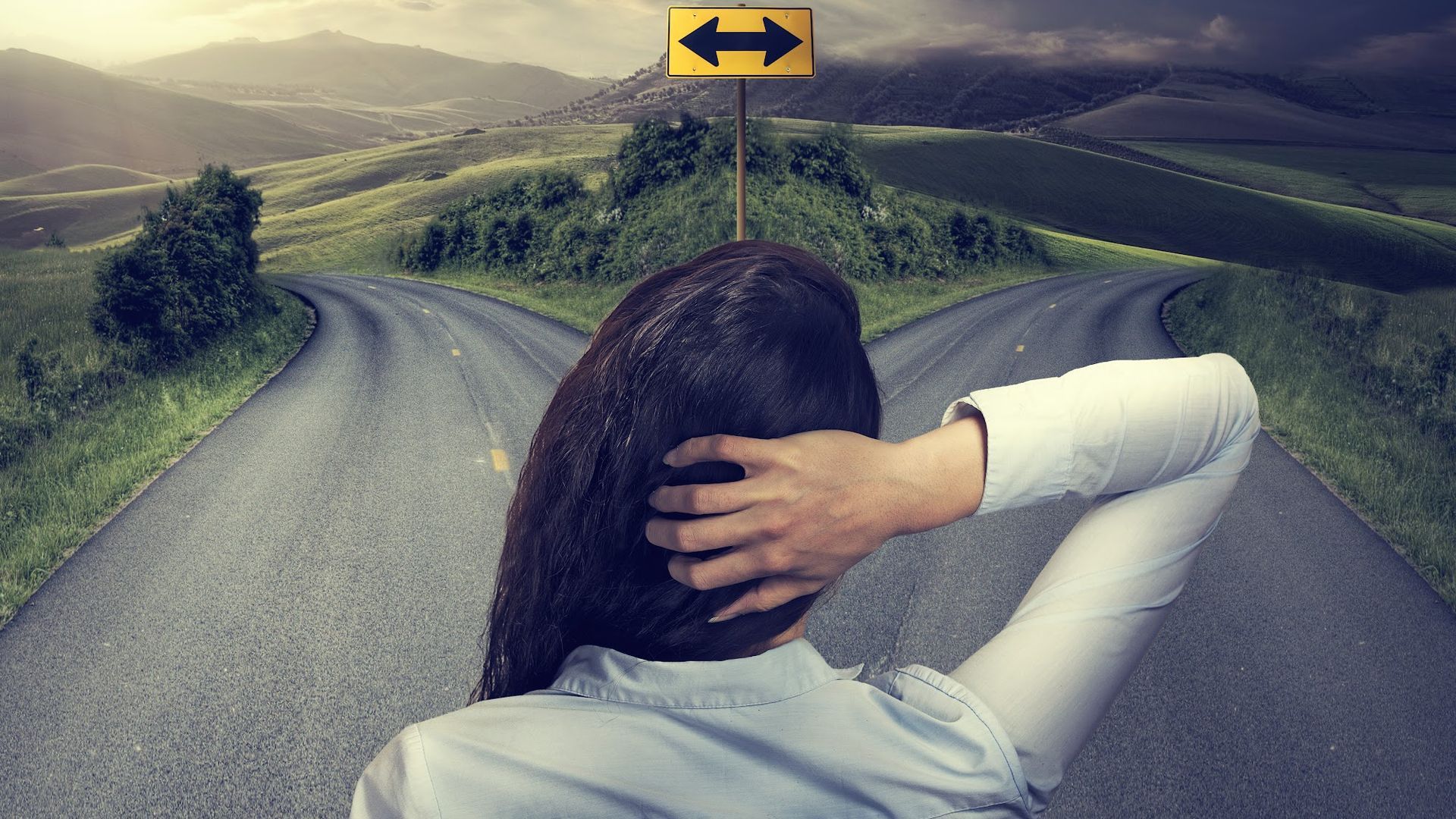 Woman standing at a fork in a road, hand on head; sign pointing left and right; outdoor setting.