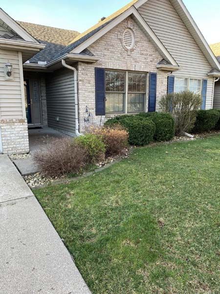 A house with a lot of grass in front of it