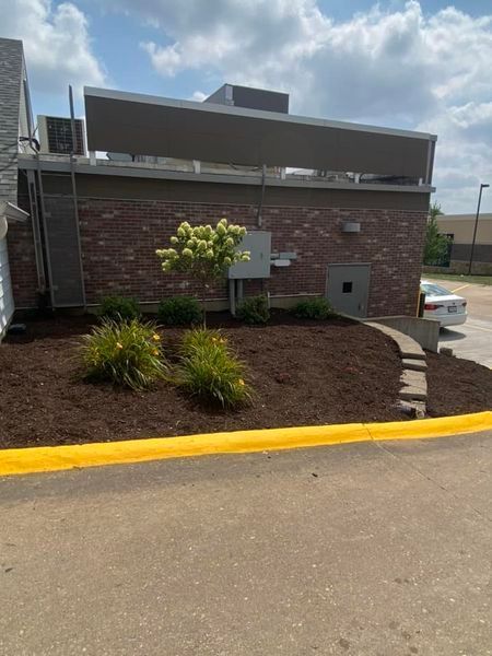 A brick building with a car parked in front of it