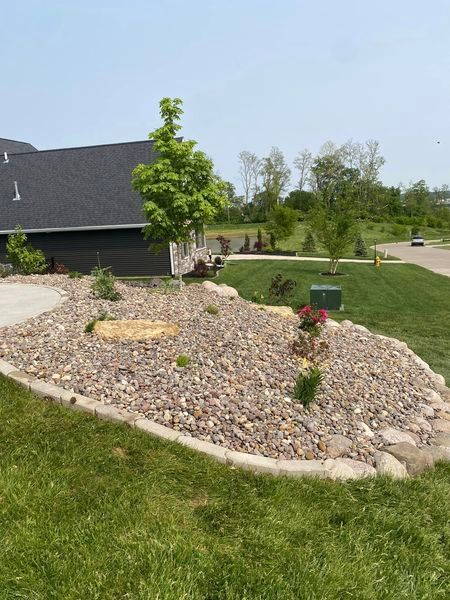 A house with a lot of rocks in front of it
